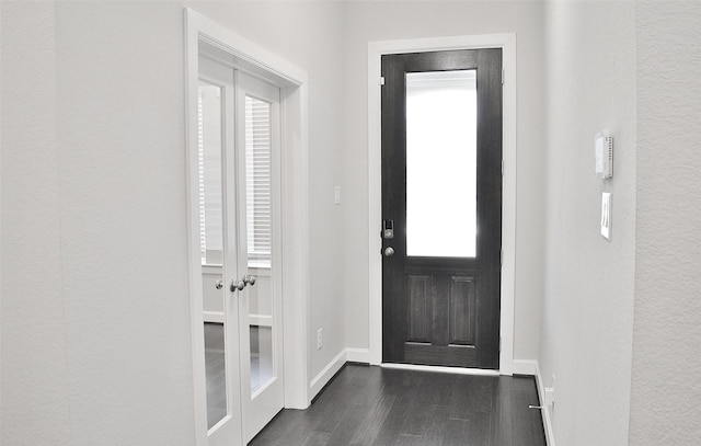 9323 Stablewood Lakes Ln, Tomball, TX 77375 - foyer entrance with dark wood-style floors and baseboards