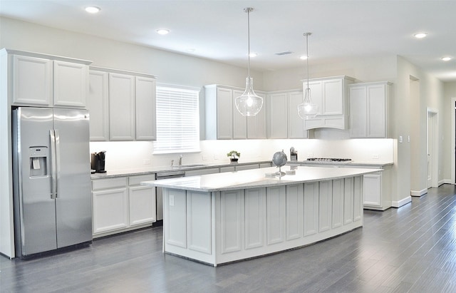 9323 Stablewood Lakes Ln, Tomball, TX 77375 - kitchen with stainless steel fridge with ice dispenser, gas cooktop, white cabinets, a kitchen island with sink, and recessed lighting