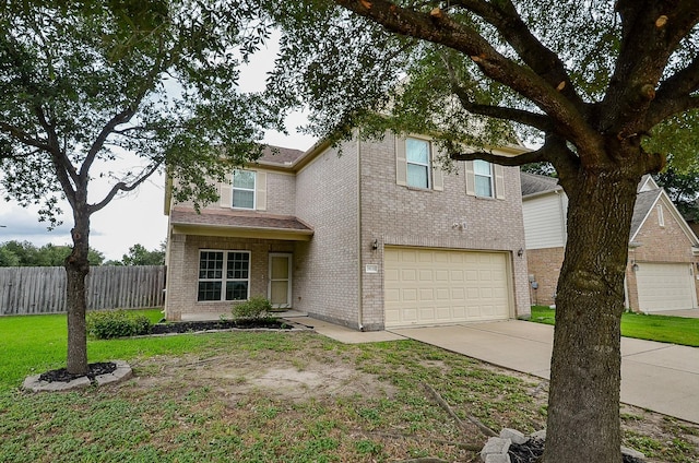 19038 Winding Stream Ln, Houston, TX 77084 - traditional-style house featuring a garage, driveway, and brick siding