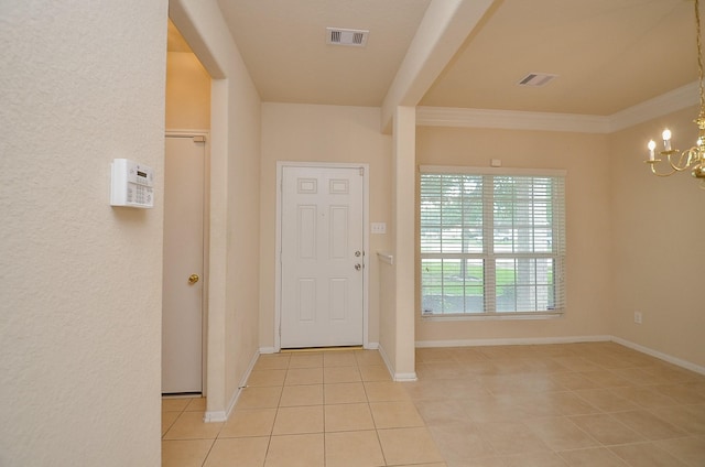 19038 Winding Stream Ln, Houston, TX 77084 - entryway featuring a chandelier, light tile patterned floors, and crown molding