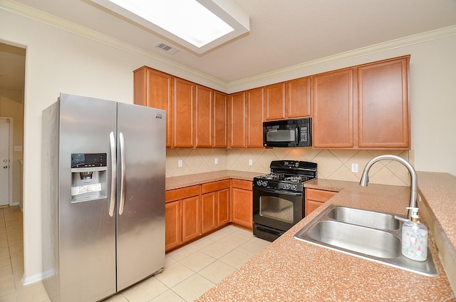 19038 Winding Stream Ln, Houston, TX 77084 - kitchen with black appliances, ornamental molding, backsplash, light tile patterned floors, and light countertops