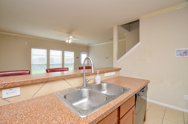 19038 Winding Stream Ln, Houston, TX 77084 - kitchen featuring dishwasher, ceiling fan, light tile patterned flooring, ornamental molding, and open floor plan