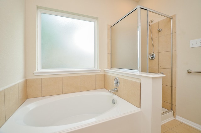 19038 Winding Stream Ln, Houston, TX 77084 - full bathroom featuring a bath, a shower stall, and tile patterned floors