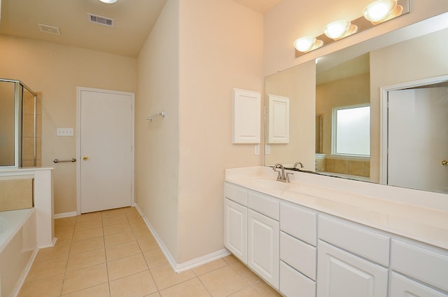 19038 Winding Stream Ln, Houston, TX 77084 - bathroom with tile patterned flooring, a garden tub, vanity, and a shower with door