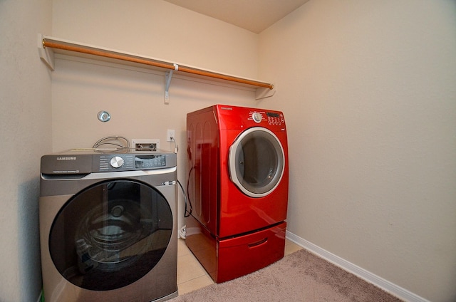 19038 Winding Stream Ln, Houston, TX 77084 - laundry room featuring separate washer and dryer and light tile patterned floors