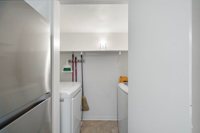 3500 Tangle Brush Dr Unit 28, The Woodlands, TX 77381 - washroom featuring independent washer and dryer and baseboards