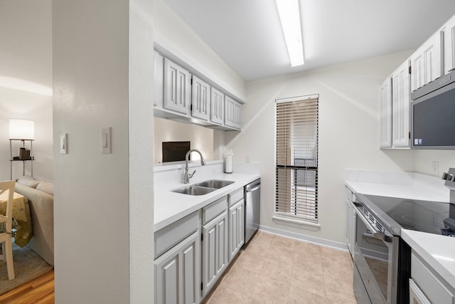 3500 Tangle Brush Dr Unit 28, The Woodlands, TX 77381 - kitchen featuring stainless steel appliances, light countertops, and light tile patterned floors