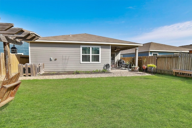 25106 Dickens Dr, Magnolia, TX 77355 - rear view of house with a fenced backyard, a ceiling fan, and a patio