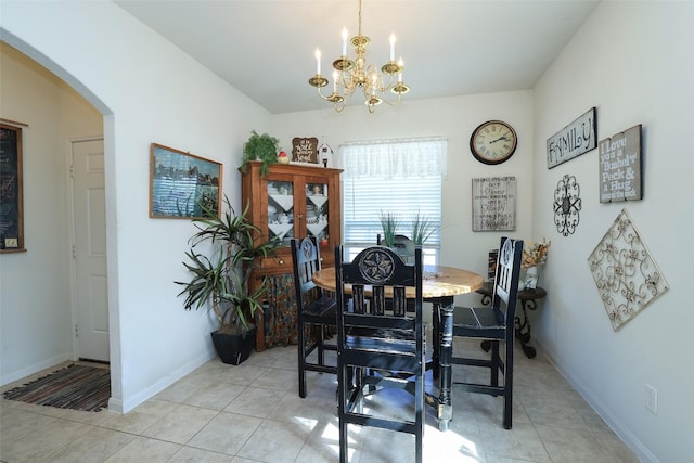 25106 Dickens Dr, Magnolia, TX 77355 - dining area featuring arched walkways, a chandelier, and light tile patterned flooring