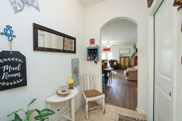 25106 Dickens Dr, Magnolia, TX 77355 - corridor featuring arched walkways and tile patterned floors