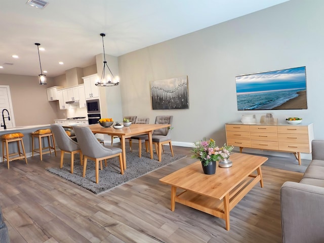 1438B Dian St, Houston, TX 77008 - dining room with wood finished floors, recessed lighting, and a chandelier