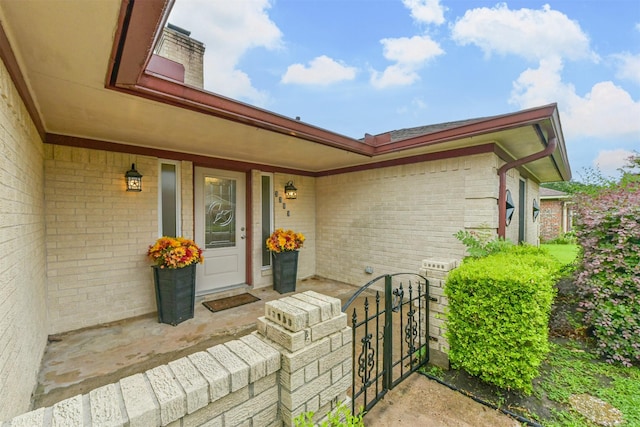 3313 Park Dale Dr, Deer Park, TX 77536 - entrance to property featuring brick siding, a porch, and a chimney
