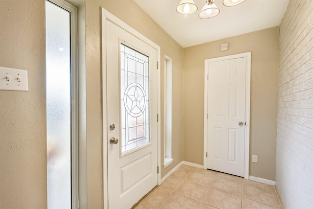 3313 Park Dale Dr, Deer Park, TX 77536 - foyer entrance with light tile patterned floors and a chandelier