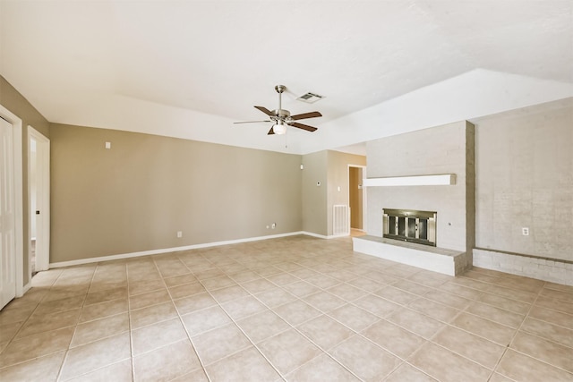 3313 Park Dale Dr, Deer Park, TX 77536 - unfurnished living room with light tile patterned floors, a ceiling fan, a fireplace, and vaulted ceiling