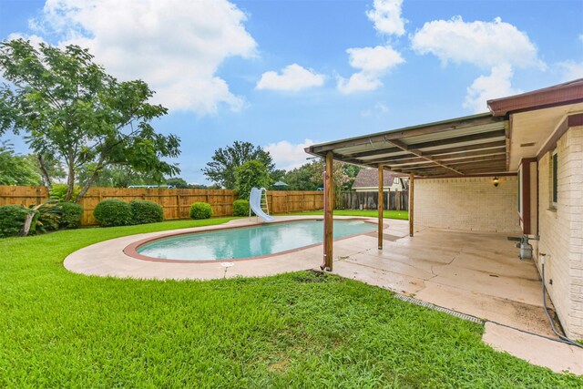 3313 Park Dale Dr, Deer Park, TX 77536 - view of pool featuring a water slide, a fenced backyard, and a patio