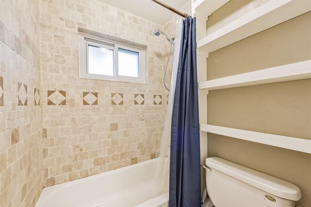 3313 Park Dale Dr, Deer Park, TX 77536 - bathroom featuring shower / bathtub combination with curtain and toilet