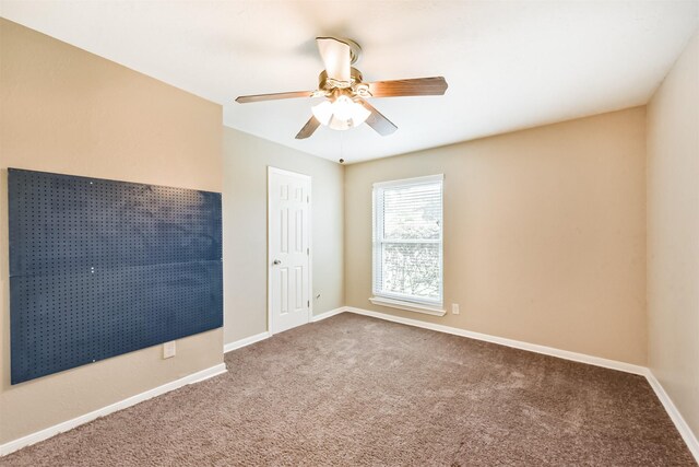3313 Park Dale Dr, Deer Park, TX 77536 - carpeted spare room featuring baseboards and a ceiling fan