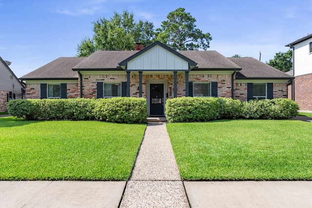1011 Martin St, Houston, TX 77018 - view of front of property featuring a front lawn, brick siding, and roof with shingles
