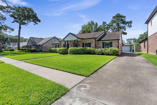 1011 Martin St, Houston, TX 77018 - view of front of property featuring brick siding, a detached garage, a front yard, an outdoor structure, and a chimney