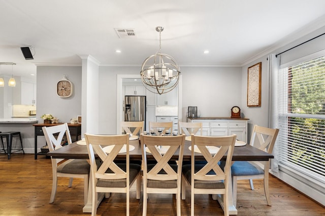 1011 Martin St, Houston, TX 77018 - dining area with a chandelier, recessed lighting, crown molding, and wood finished floors