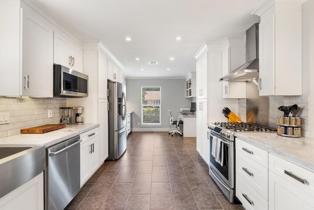 1011 Martin St, Houston, TX 77018 - kitchen featuring appliances with stainless steel finishes, wall chimney range hood, white cabinetry, decorative backsplash, and recessed lighting