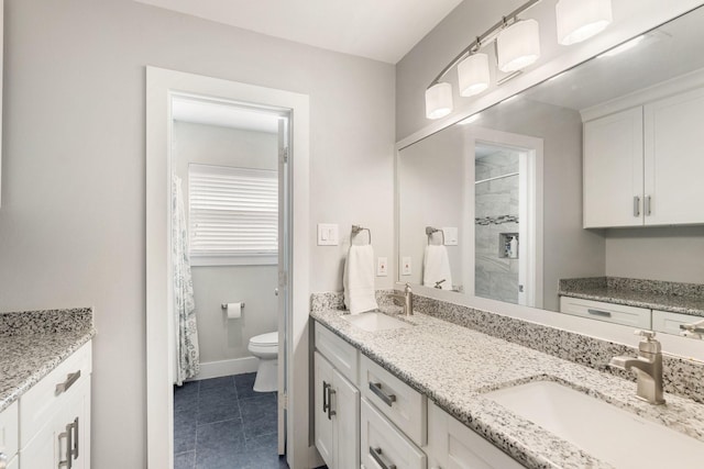 1011 Martin St, Houston, TX 77018 - full bath featuring double vanity, tiled shower, and tile patterned flooring