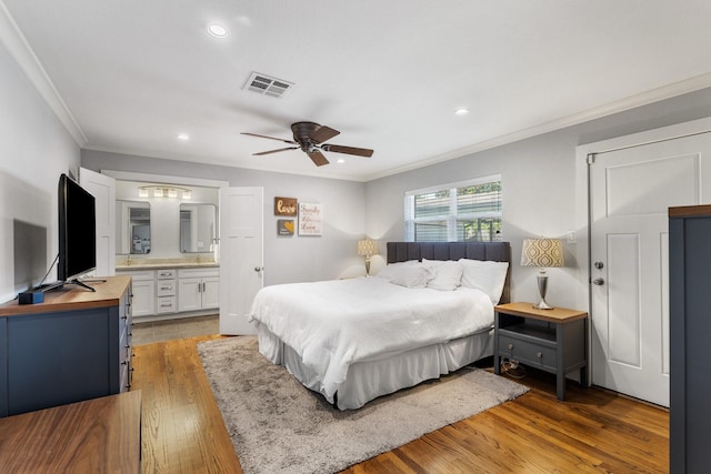1011 Martin St, Houston, TX 77018 - bedroom with ornamental molding, wood finished floors, recessed lighting, connected bathroom, and a ceiling fan