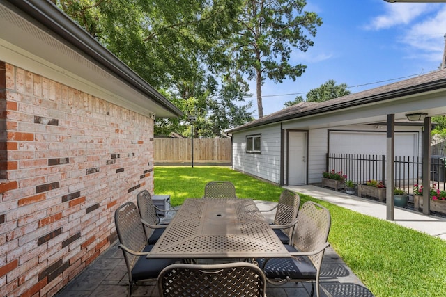 1011 Martin St, Houston, TX 77018 - fenced backyard with outdoor dining space, a patio, and a garage