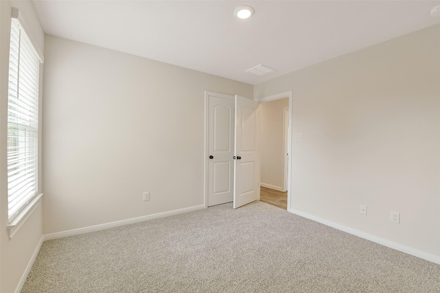 405 3rd St, Hempstead, TX 77445 - spare room with light colored carpet, plenty of natural light, recessed lighting, and a smoke detector