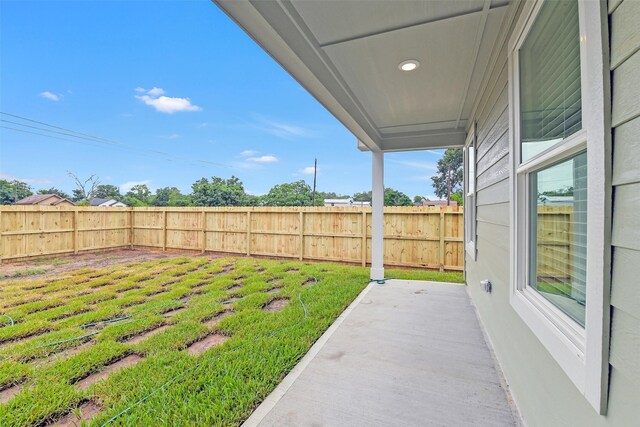 405 3rd St, Hempstead, TX 77445 - fenced backyard with a patio area