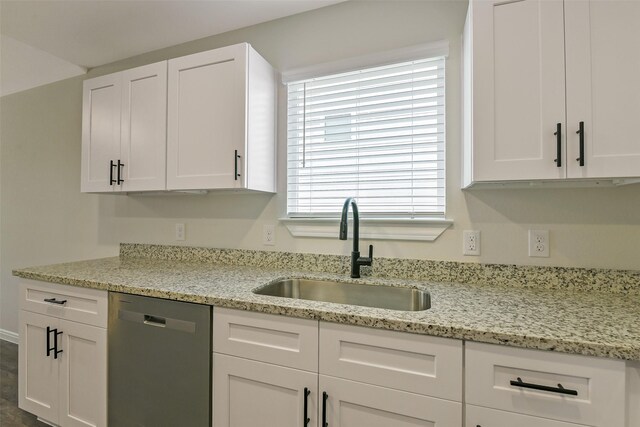 405 3rd St, Hempstead, TX 77445 - kitchen with stainless steel dishwasher, white cabinets, and light stone countertops
