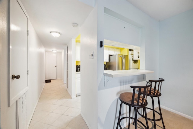 4001 E Nasa Rd Unit 118, Seabrook, TX 77586 - hall featuring washer / clothes dryer and light tile patterned floors
