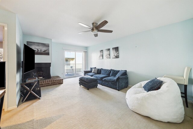 4001 E Nasa Rd Unit 118, Seabrook, TX 77586 - living room featuring a ceiling fan, a fireplace, and carpet floors