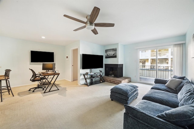 4001 E Nasa Rd Unit 118, Seabrook, TX 77586 - living area featuring light colored carpet, a ceiling fan, and a fireplace