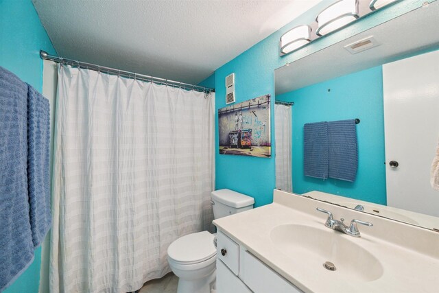 4001 E Nasa Rd Unit 118, Seabrook, TX 77586 - bathroom with vanity, a textured ceiling, and a shower with curtain