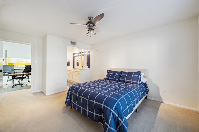 4001 E Nasa Rd Unit 118, Seabrook, TX 77586 - carpeted bedroom featuring a desk, a ceiling fan, and ensuite bathroom