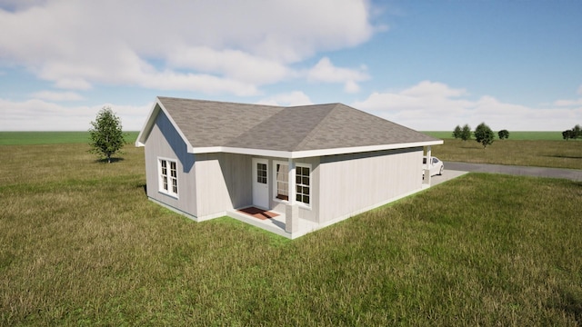 212 Kyle St, Madisonville, TX 77864 - rear view of property featuring a yard