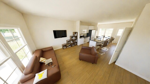 212 Kyle St, Madisonville, TX 77864 - living area featuring light wood-style floors and baseboards