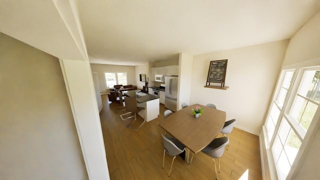 212 Kyle St, Madisonville, TX 77864 - dining area featuring wood finished floors and baseboards