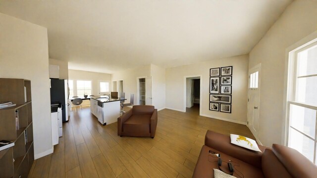 212 Kyle St, Madisonville, TX 77864 - living area with baseboards and wood finished floors