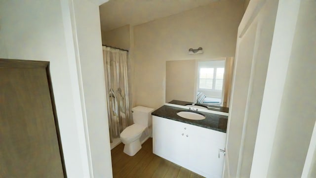 212 Kyle St, Madisonville, TX 77864 - bathroom featuring vanity, wood finished floors, and a shower with shower curtain