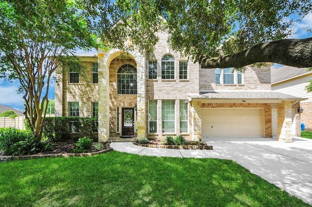 30103 Canyon Branch Ct, Spring, TX 77386 - view of front facade featuring concrete driveway, a front lawn, a garage, and stone siding