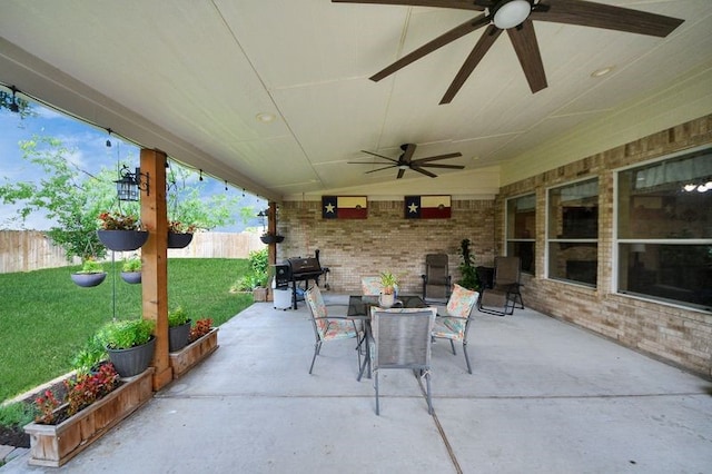 30103 Canyon Branch Ct, Spring, TX 77386 - fenced backyard with a ceiling fan, outdoor dining area, a patio, and grilling area
