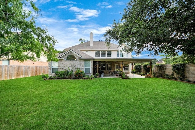30103 Canyon Branch Ct, Spring, TX 77386 - back of property with a patio, a fenced backyard, and a chimney