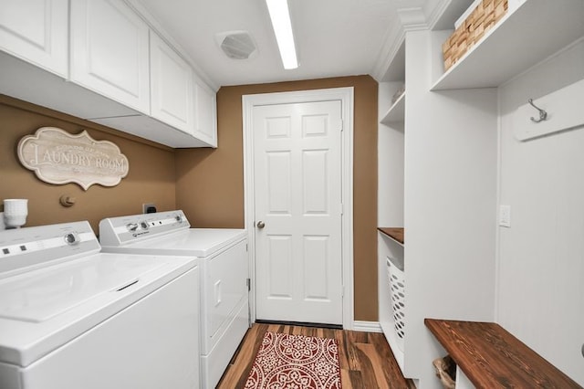 30103 Canyon Branch Ct, Spring, TX 77386 - laundry area with cabinet space, washer and dryer, and dark wood finished floors