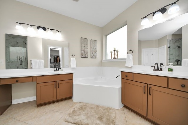 30103 Canyon Branch Ct, Spring, TX 77386 - bathroom featuring a marble finish shower, two vanities, and tile patterned floors