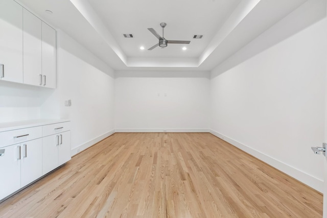 5216 Chestnut St, Bellaire, TX 77401 - unfurnished room featuring ceiling fan, light wood-type flooring, a tray ceiling, and recessed lighting