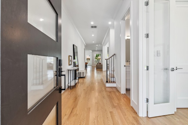 5216 Chestnut St, Bellaire, TX 77401 - corridor featuring light wood-style flooring, stairs, and recessed lighting