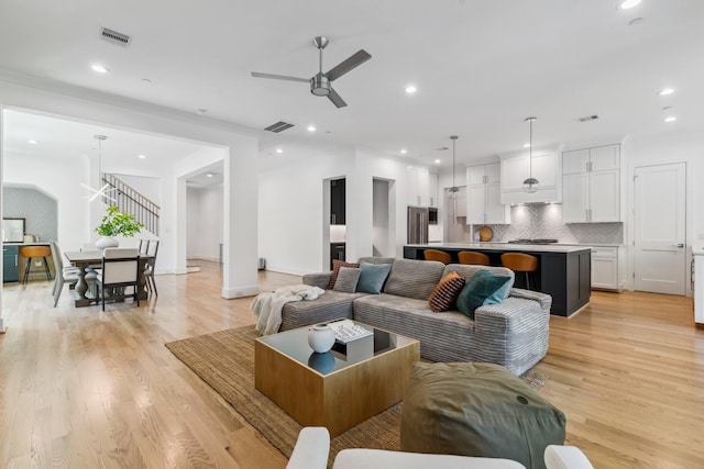 5216 Chestnut St, Bellaire, TX 77401 - living room with ceiling fan, light wood-style flooring, and recessed lighting