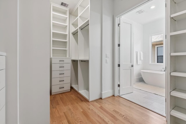 5216 Chestnut St, Bellaire, TX 77401 - spacious closet with wood finished floors